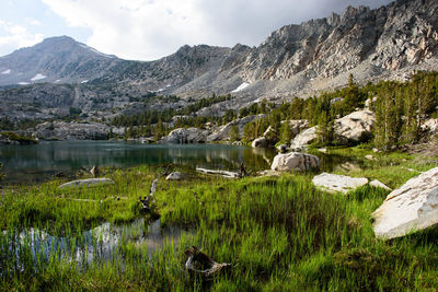 Scenic view of lake and mountains against sky