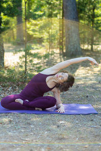 Low section of woman sitting on field