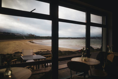 Scenic view of sea seen through glass window