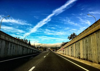 View of road against cloudy sky