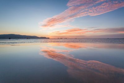 Scenic view of sea against sky at sunset