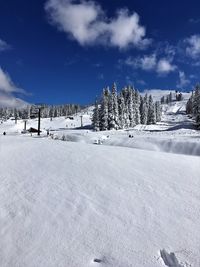 Scenic view of snow covered landscape against sky