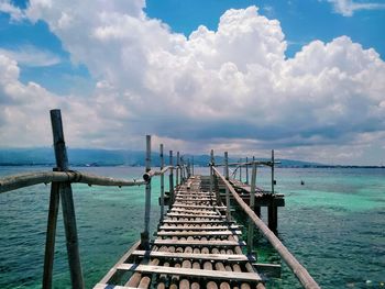 Pier over sea against sky