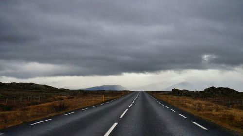 Road amidst landscape against sky
