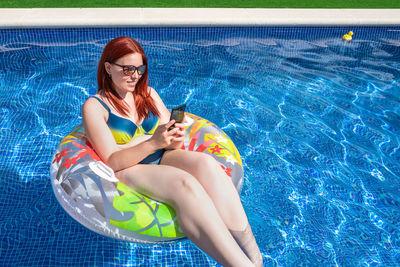 Young woman swimming in pool