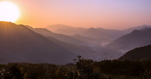 Scenic view of mountains against sky during sunset