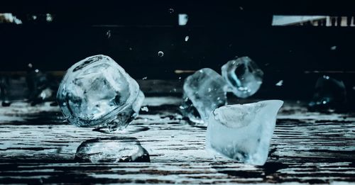 Close-up of water splashing on table