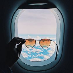 Scenic view of sea seen through glass window