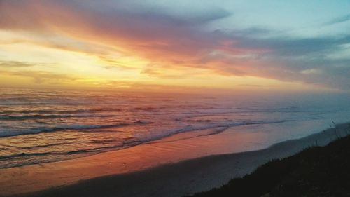 Scenic view of sunset over sea