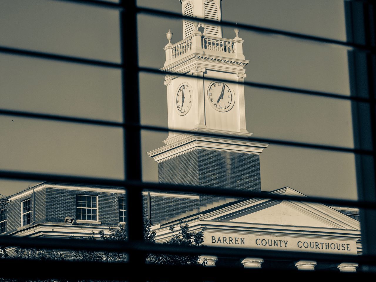 building exterior, architecture, time, clock, built structure, tower, clock tower, city, low angle view, no people, skyscraper, travel destinations, outdoors, day, clock face, sky, minute hand, close-up