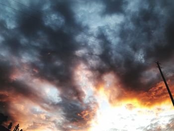 Low angle view of dramatic sky during sunset