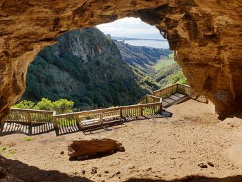 Scenic view of mountain seen through arch