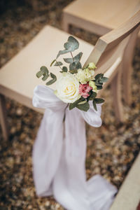 Midsection of woman holding bouquet