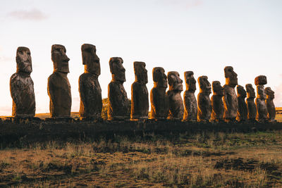 Statues on land  against clear sky