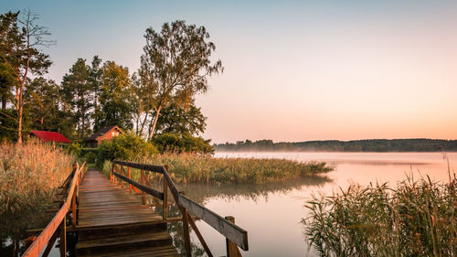 Scenic view of lake against sky during sunset