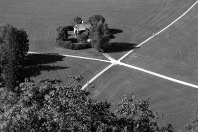 High angle view of road amidst trees in city