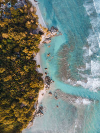 High angle view of rocks by sea