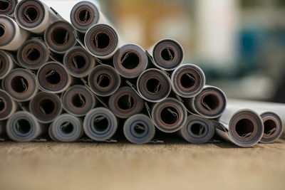 Close-up of stacked fabrics arranged on table in industry