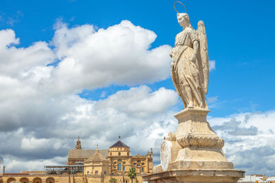 Low angle view of statue against sky