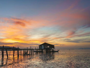 Scenic view of sea against orange sky