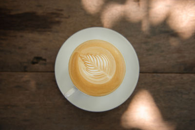 High angle view of cappuccino on table