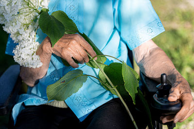 Midsection of man holding hands