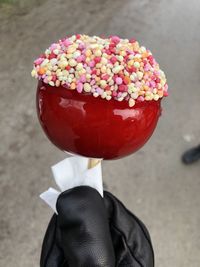 Close-up of hand holding ice cream