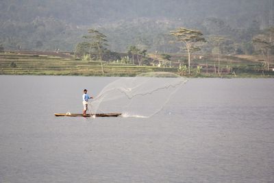 Side view of man on boat