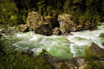 Scenic view of water flowing through rocks