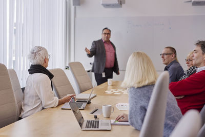 People taking during business meeting