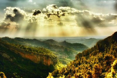 Scenic view of landscape against cloudy sky