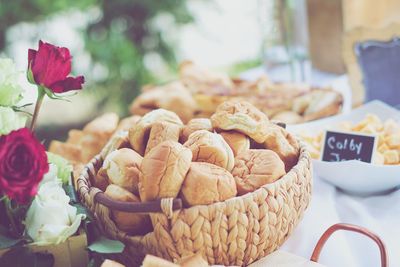 Close-up of roses in basket on table