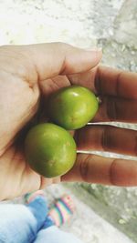 Close-up of hand holding fruit