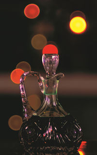 Close-up of illuminated lighting equipment on table