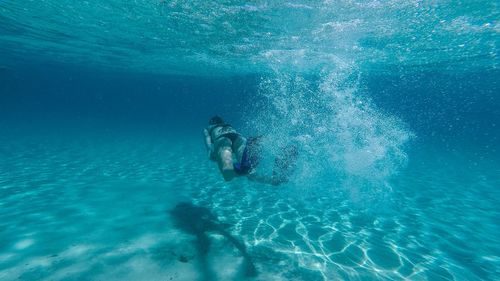 Woman swimming in sea