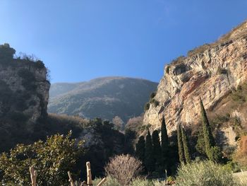 Scenic view of mountains against clear blue sky