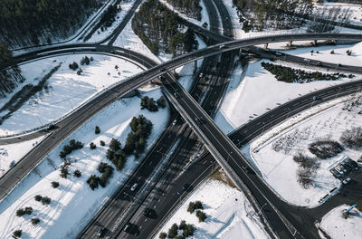 Two lane western highway bypass and intersection from aerial perspective in vilnius, lithuania