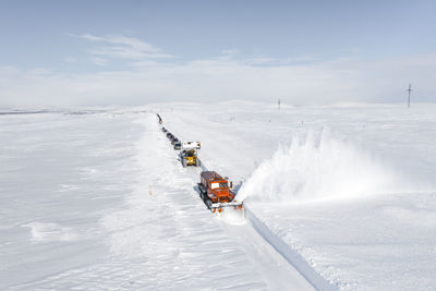 Scenic view of snow covered land