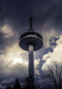 Low angle view of communications tower against sky