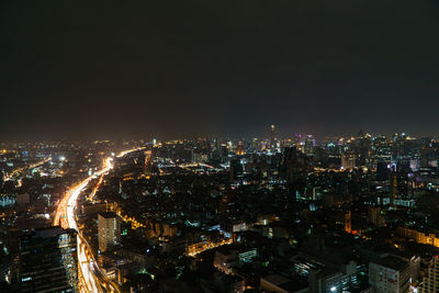 Aerial view of illuminated cityscape at night