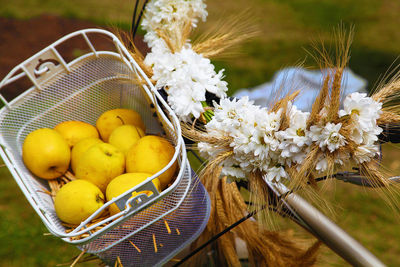 High angle view of yellow fruits in bicycle basket