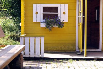 Open door of yellow house