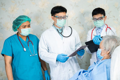 Female doctor examining patient in hospital