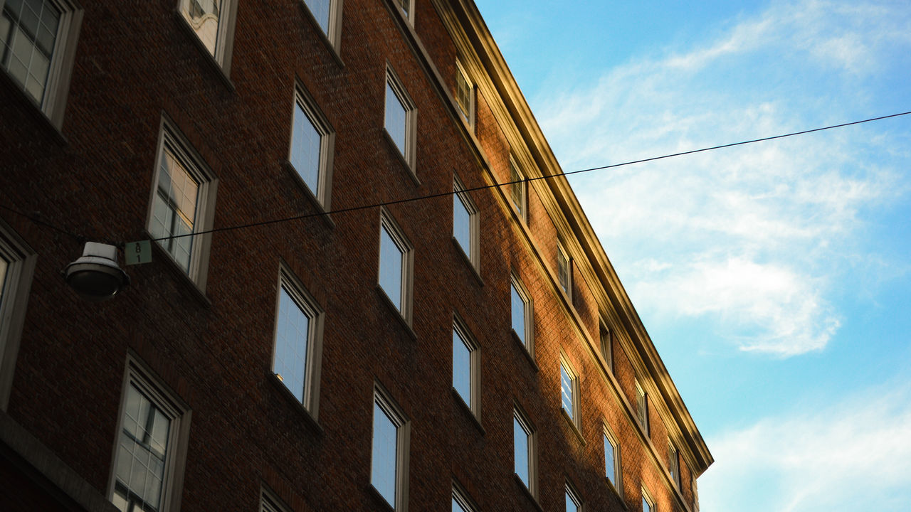 LOW ANGLE VIEW OF RESIDENTIAL BUILDINGS AGAINST SKY