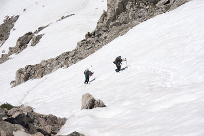 High angle view of people on snow covered mountain