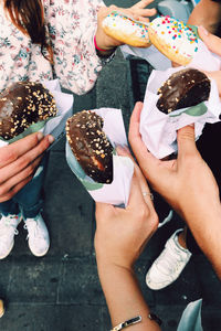 High angle view of woman holding ice cream