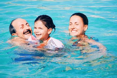 Friends enjoying in swimming pool