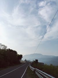 Empty road against sky