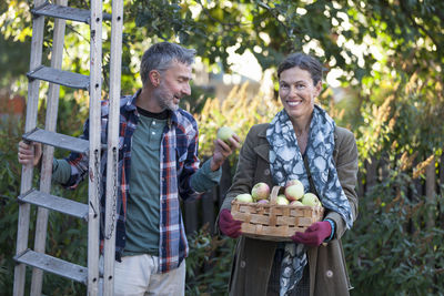 Mature couple with apples in basket, stockholm, sweden