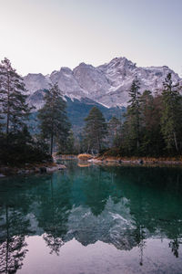 Scenic view of lake and mountains against sky